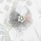 Oversized 40 mm flower button with silver petals, grey and pink floral center, shank back. Lightweight and perfect for sewing or crafts