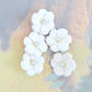 White flower buttons for decorating and sewing. Set of 5, with a shank. Great for assemblage art, repurposed projects, and bridal jewelry