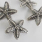 Set of 4 starfish-shaped 20mm metal buttons with a textured finish and shank back - For clothes
