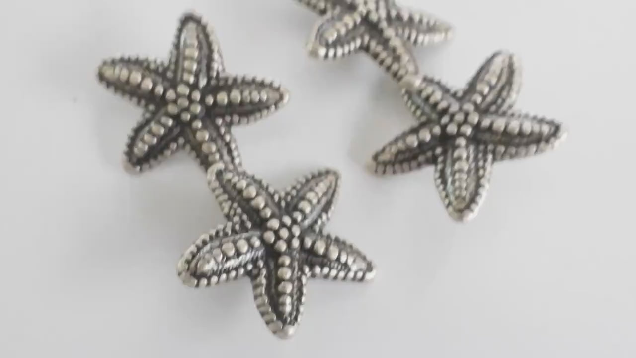 Set of 4 starfish-shaped 20mm metal buttons with a textured finish and shank back - For clothes