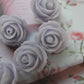Purple flower-shaped buttons for sewing and jewelry. Embellishments hair accessories