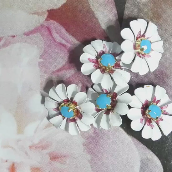Daisy flower-shaped buttons! Hand-painted with a cute blue rhinestone center. For crafting
