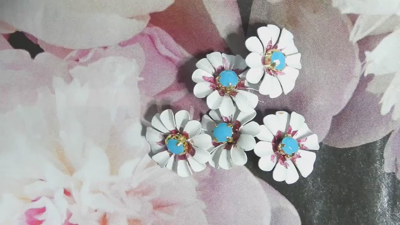 Daisy flower-shaped buttons! Hand-painted with a cute blue rhinestone center. For crafting