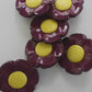 Funky 1970s-inspired flower buttons made of durable nylon. Set of 6 with burgundy petals