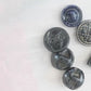 10 Czech black glass buttons from Europe. Perfect embellishments for thrifted or inherited garments—perfect for upcycling. With a shank back