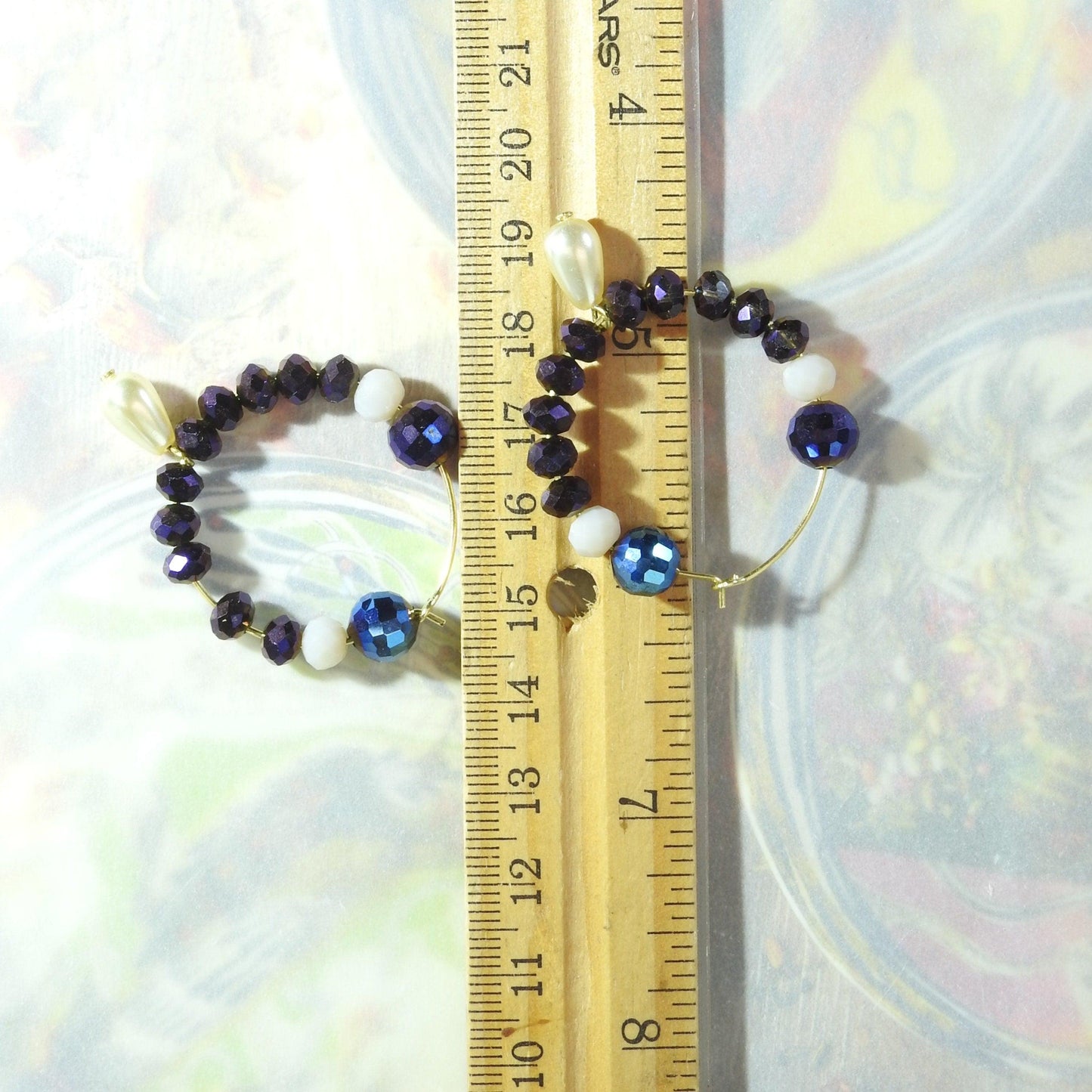 Purple glass bead earrings hoop with eye-catching dark blue, aubergine colored, and white faceted Austria glass beads. 30 mm