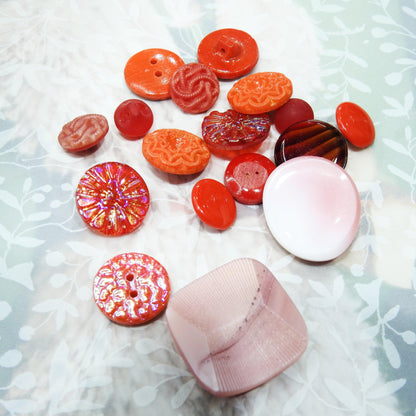 Set of assorted red and pink vintage glass buttons