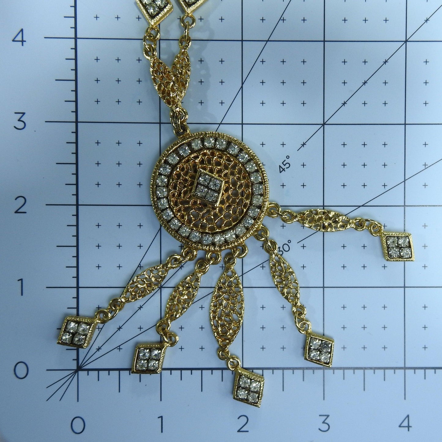 Vintage long gold pendant necklace with glass rhinestone, for business or evening wear and cocktail party.