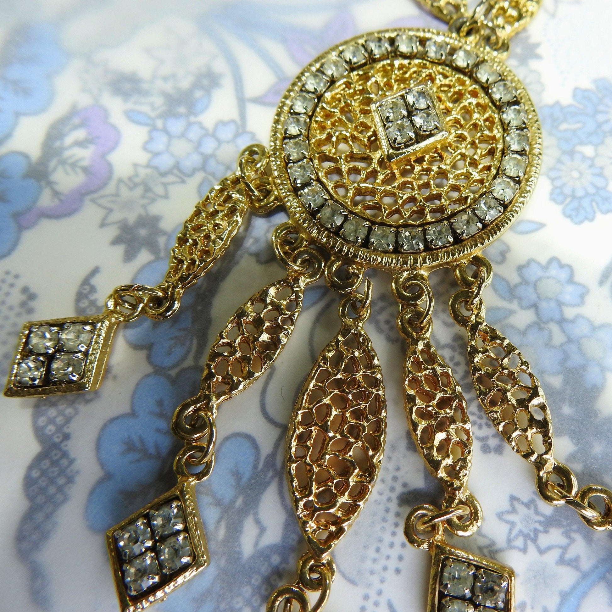 Vintage long gold pendant necklace with glass rhinestone, for business or evening wear and cocktail party.