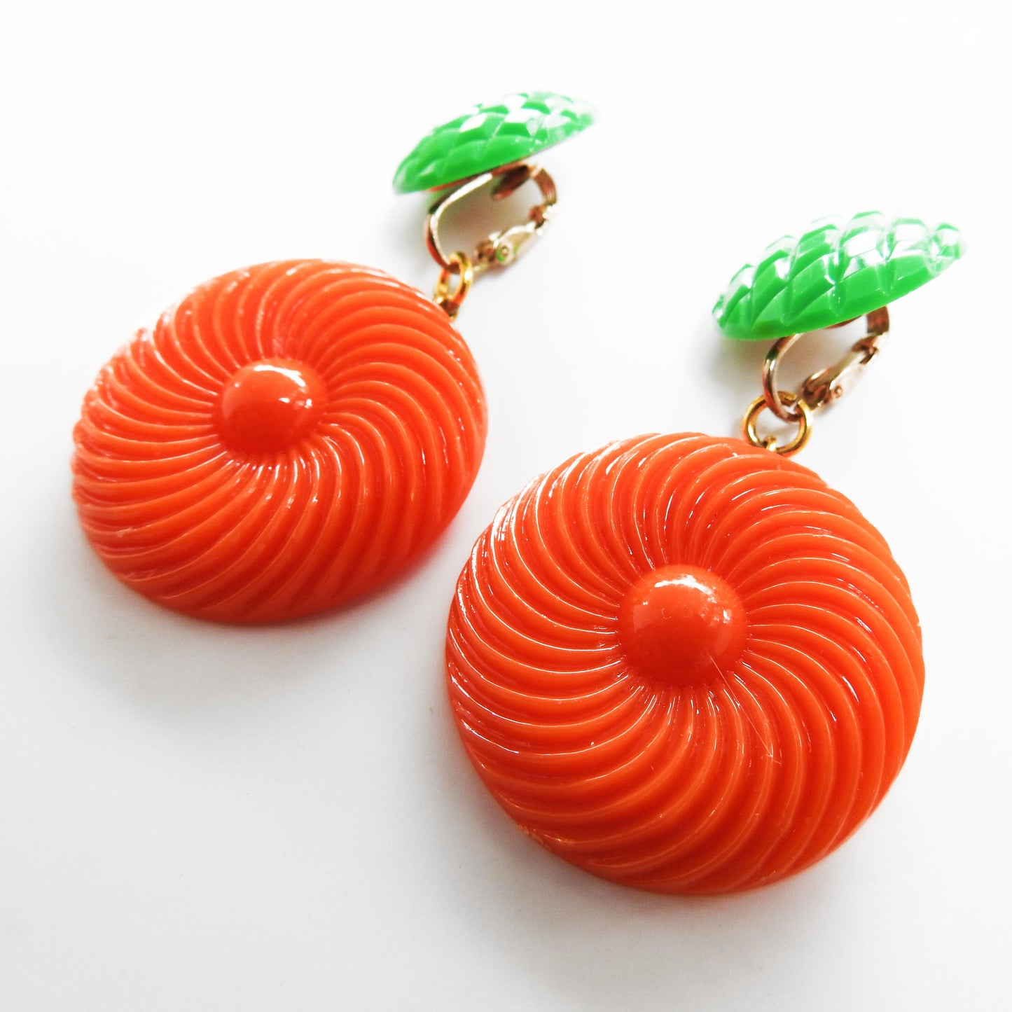 Neon orange dangle clip earrings for women. Cool jewelry gift ideas under 25 dollars. 1970s 1980s-inspired funky style. Ready to ship