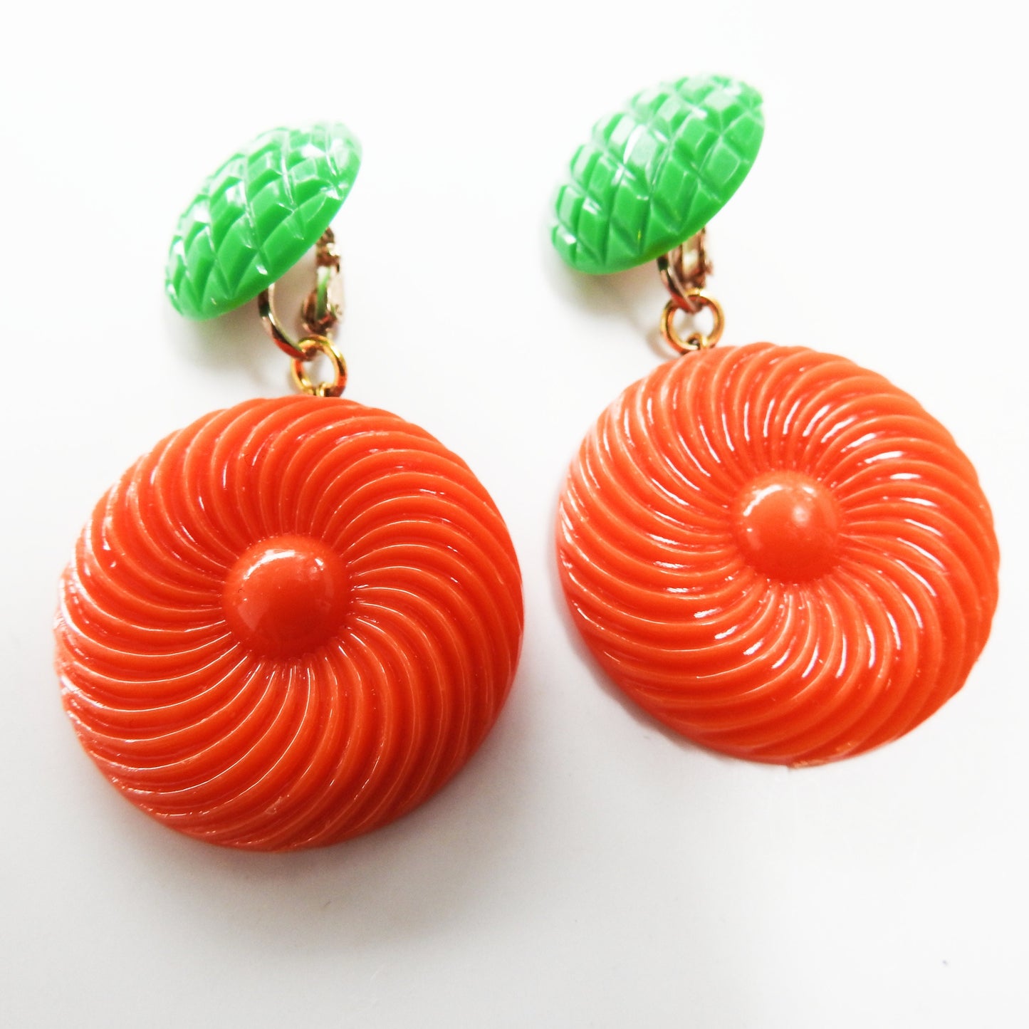 Neon orange dangle clip earrings for women. Cool jewelry gift ideas under 25 dollars. 1970s 1980s-inspired funky style. Ready to ship