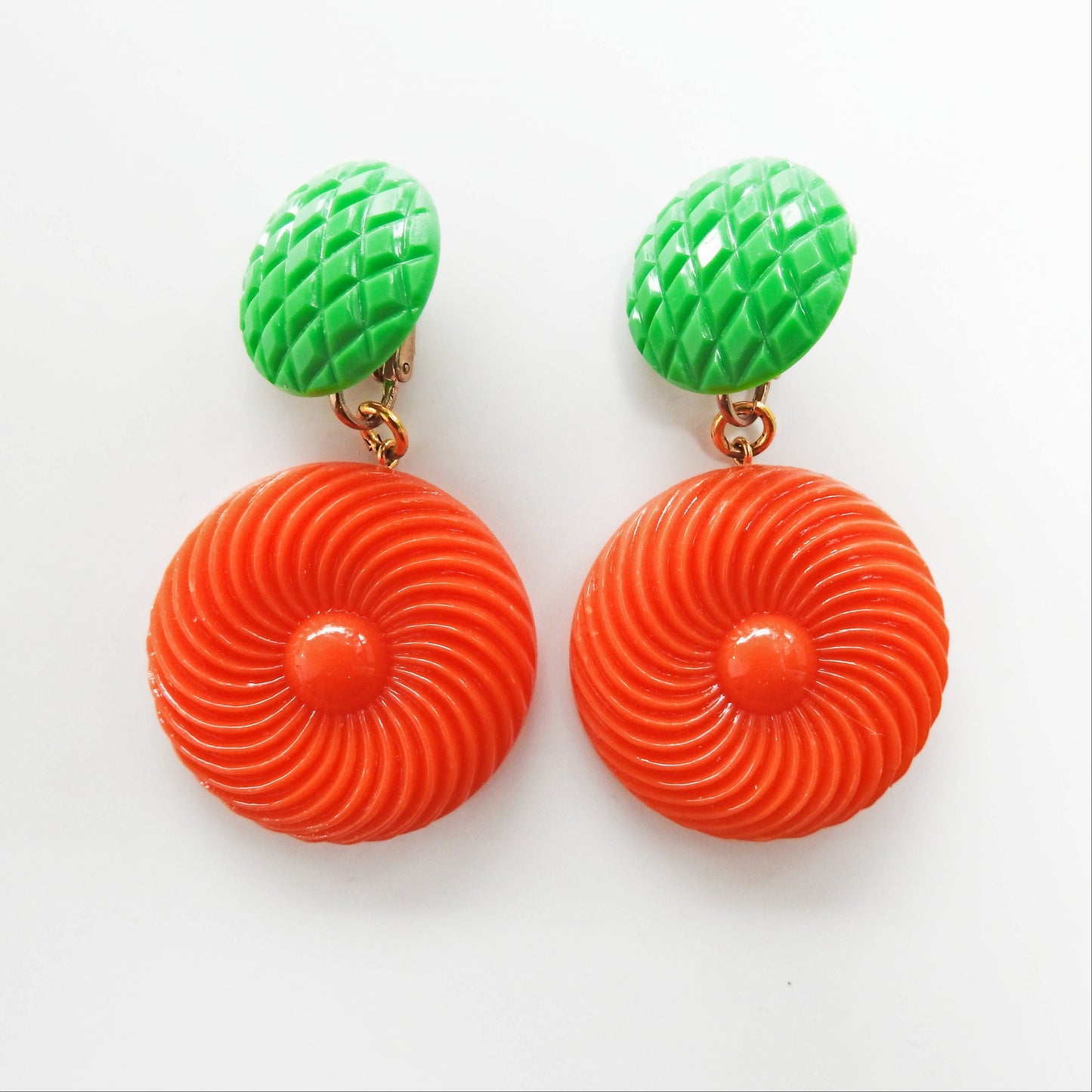 Neon orange dangle clip earrings for women. Cool jewelry gift ideas under 25 dollars. 1970s 1980s-inspired funky style. Ready to ship