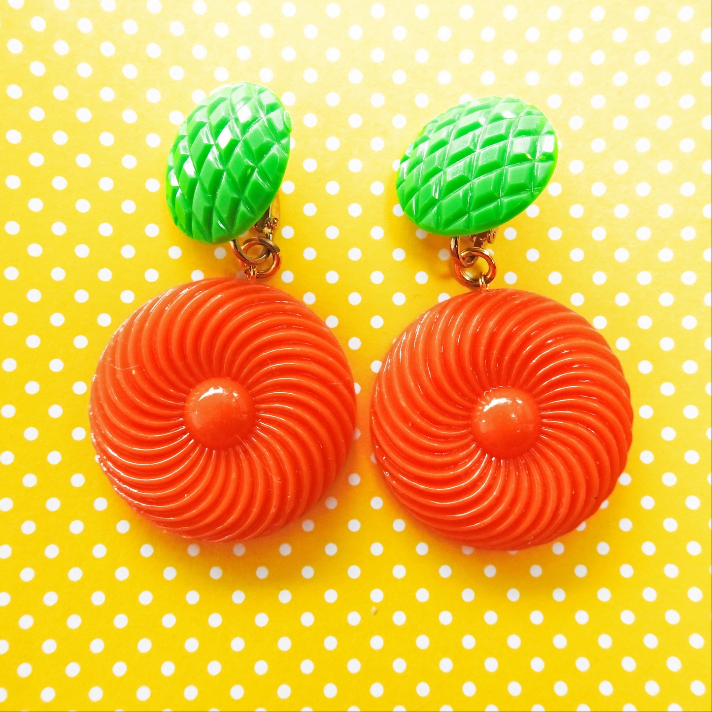 Neon orange dangle clip earrings for women. Cool jewelry gift ideas under 25 dollars. 1970s 1980s-inspired funky style. Ready to ship