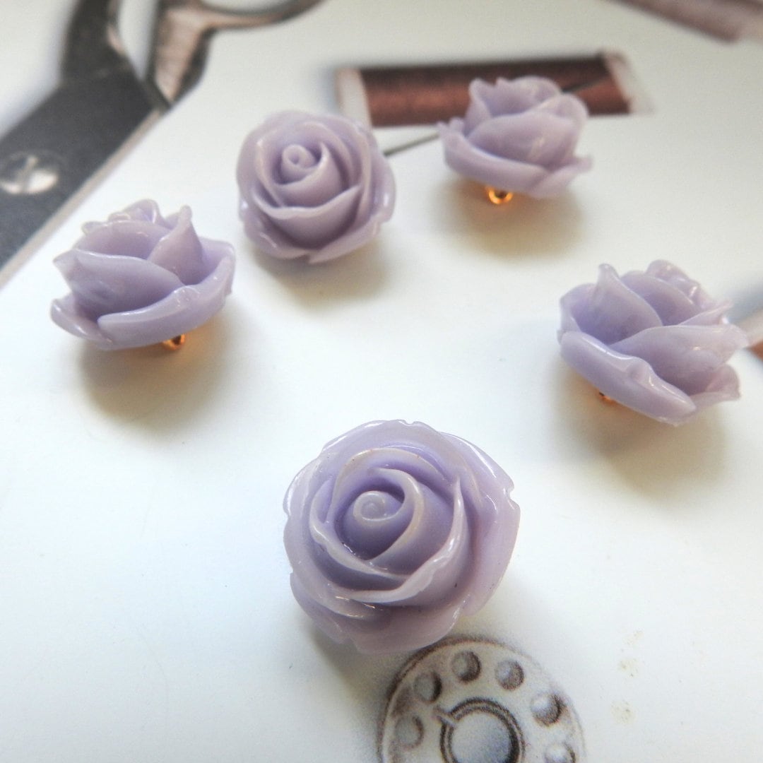 Purple flower-shaped buttons for sewing and jewelry. Embellishments hair accessories, drapery tiebacks, wedding decor, shoes, handbag, shirt